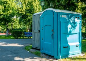 wheelchair accessible porta potty in a park